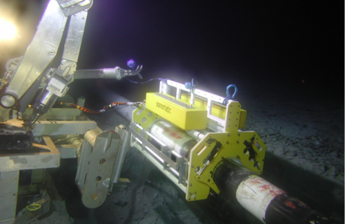 A subsea image of an in-progress pipeline inspection A subsea image of an in-progress pipeline inspection